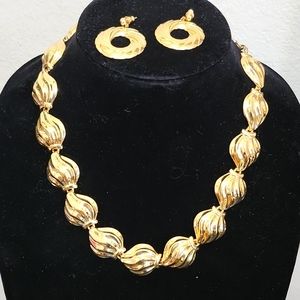 Gold toned matching necklace and earrings